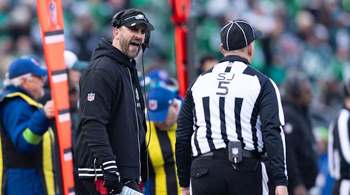 Eagles Nick Sirianni reacts with side judge Jim Quirk (5) after a play during the third quarter against the Cardinals at Lincoln Financial Field.